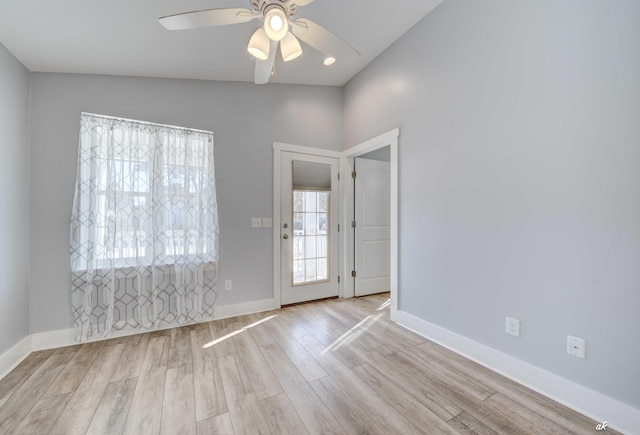 interior space featuring light wood-type flooring, vaulted ceiling, and ceiling fan