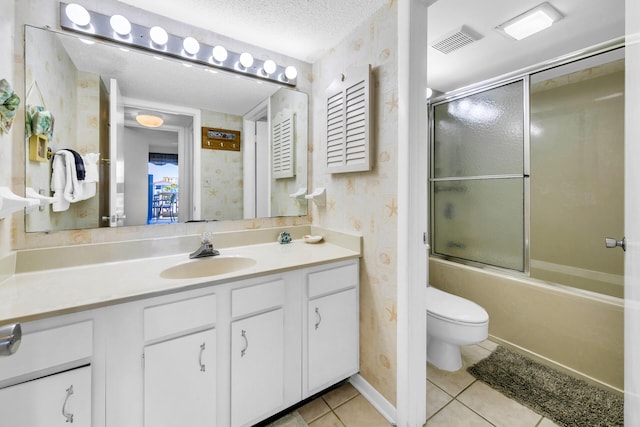 full bathroom featuring enclosed tub / shower combo, tile patterned floors, a textured ceiling, toilet, and vanity