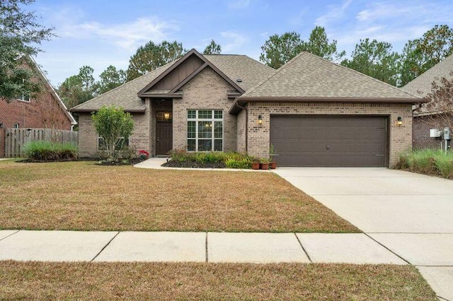 view of front of house with a garage and a front lawn