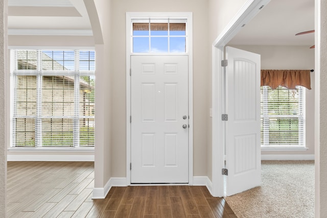 foyer entrance featuring ornamental molding