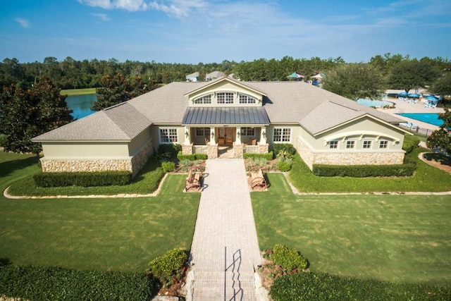 view of front of home with a front yard and a porch