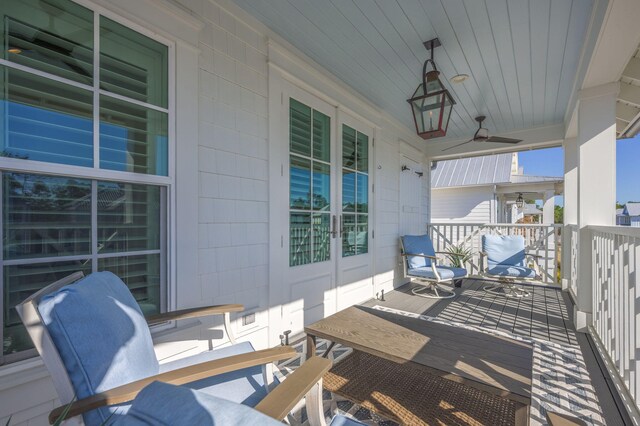 exterior space with ceiling fan and covered porch