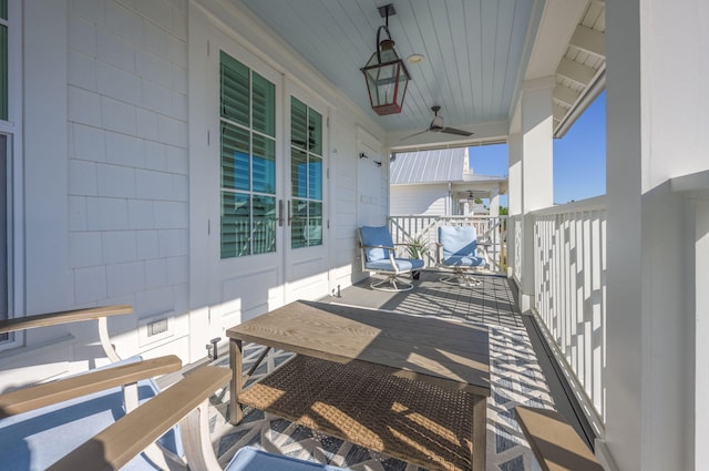 exterior space with ceiling fan