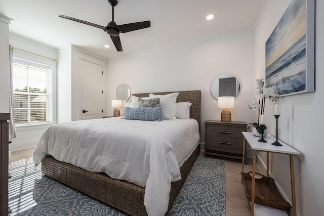 bedroom featuring dark hardwood / wood-style flooring, crown molding, and ceiling fan