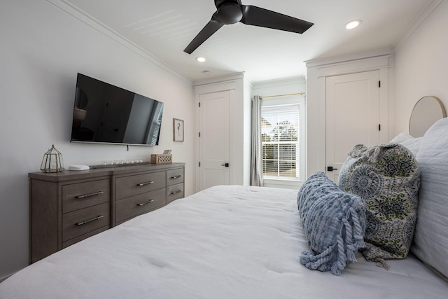 bedroom with ceiling fan and crown molding