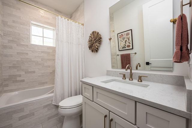 full bathroom with tile patterned floors, vanity, shower / bath combination with curtain, and toilet