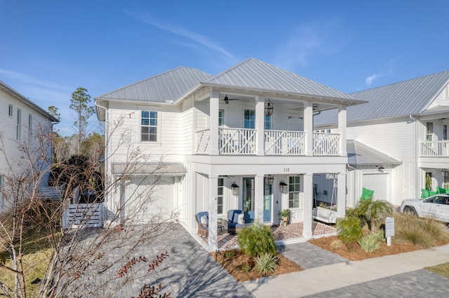 view of front of property with a garage and covered porch