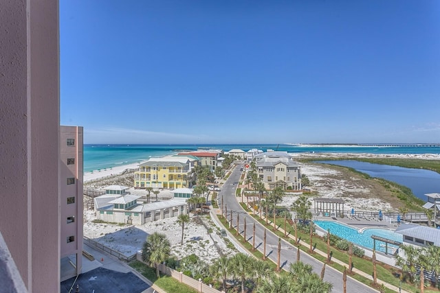 drone / aerial view featuring a view of the beach and a water view