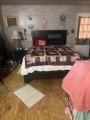 bedroom featuring wood-type flooring