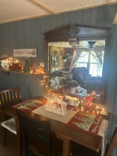 dining room with ceiling fan and wood ceiling