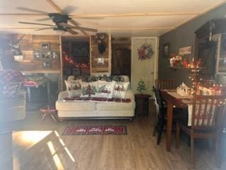 interior space featuring ceiling fan and wood-type flooring