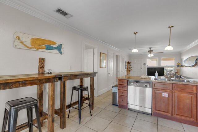 kitchen featuring decorative light fixtures, sink, ornamental molding, stainless steel dishwasher, and light tile patterned floors