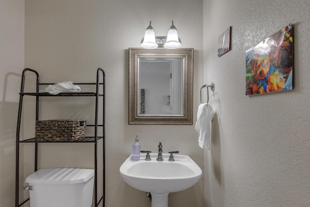 bathroom featuring sink and toilet