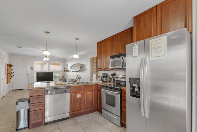 kitchen featuring light tile patterned flooring, appliances with stainless steel finishes, sink, kitchen peninsula, and crown molding