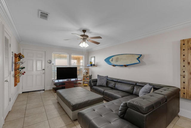 living room featuring ornamental molding, light tile patterned floors, and ceiling fan