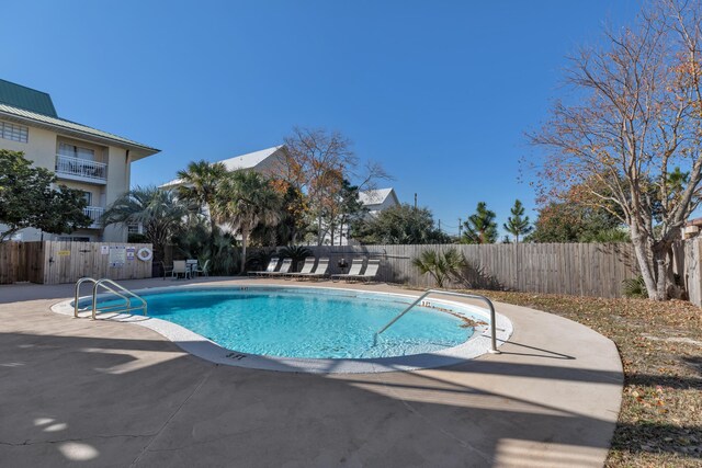 view of swimming pool with a patio area