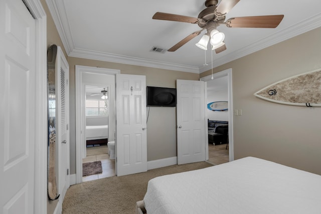 carpeted bedroom featuring crown molding and ceiling fan