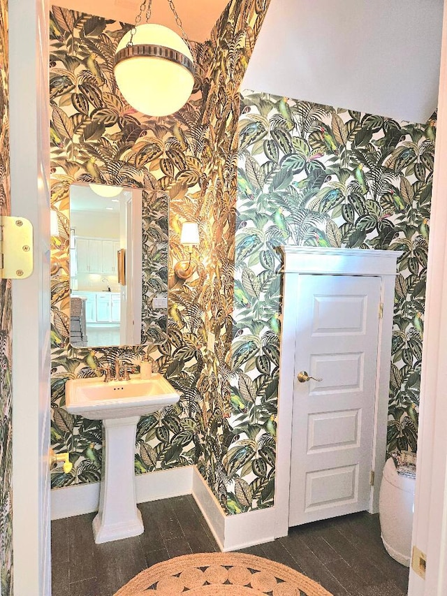 bathroom featuring hardwood / wood-style floors and toilet