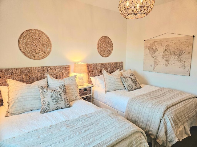 bedroom featuring a chandelier