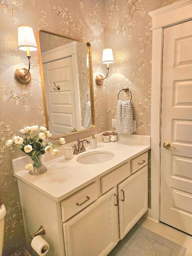 bathroom with tile patterned floors and vanity