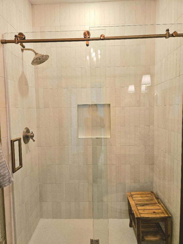 bathroom with a shower with shower door