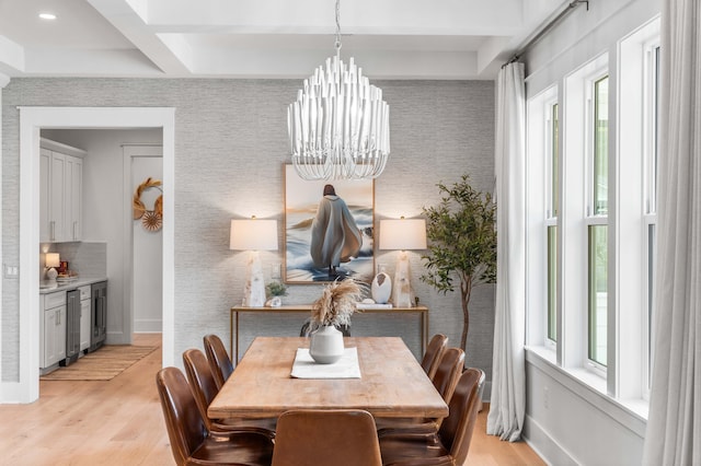 dining area with beverage cooler, coffered ceiling, a chandelier, beam ceiling, and light hardwood / wood-style flooring