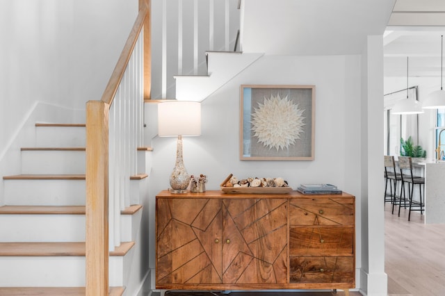 staircase with wood-type flooring