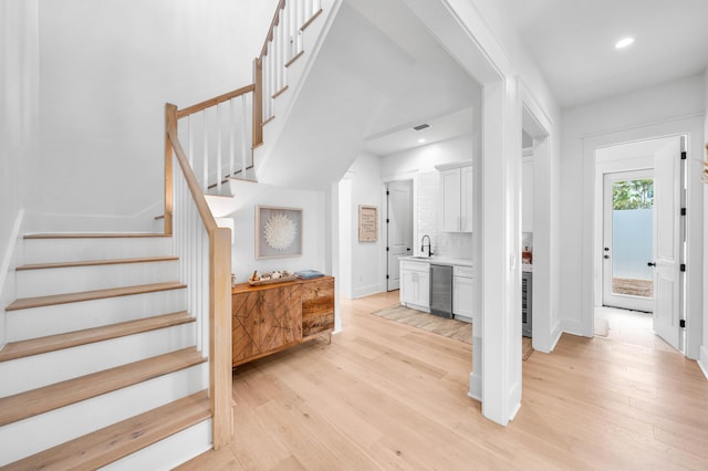 interior space featuring sink and wood-type flooring