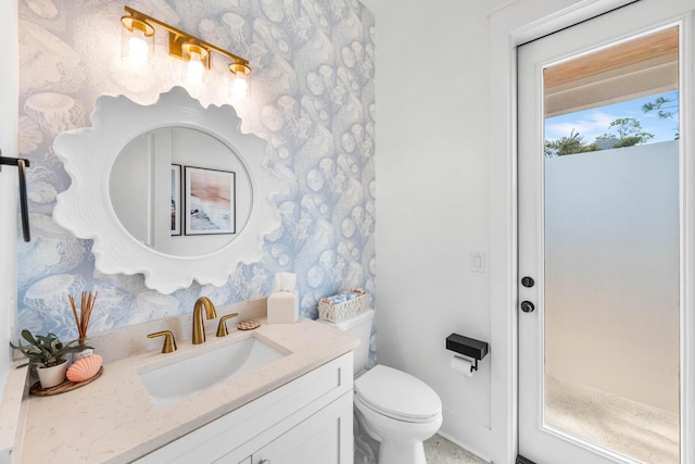 bathroom with vanity and toilet