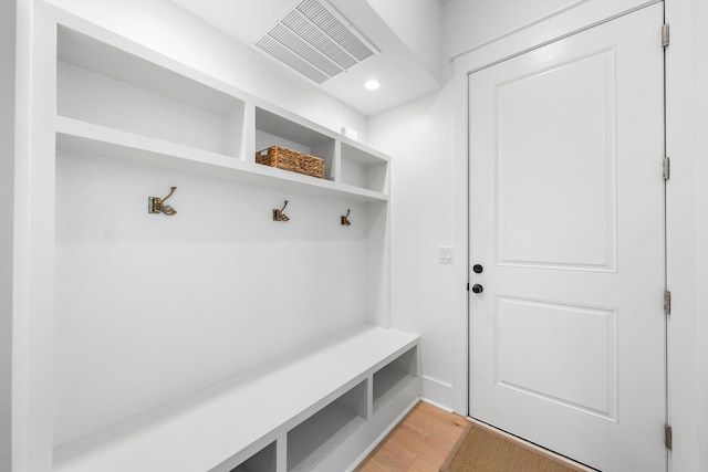 mudroom with wood-type flooring