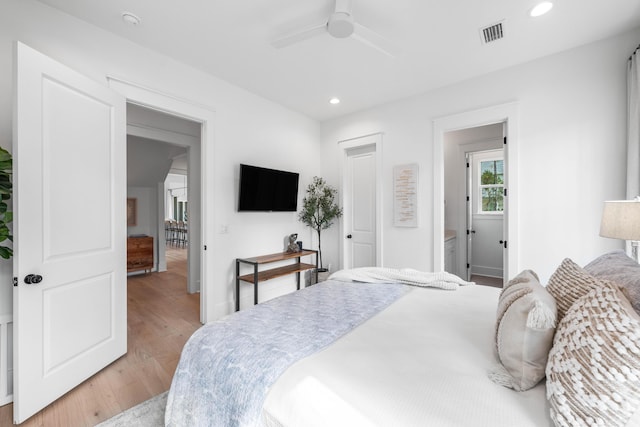 bedroom featuring light hardwood / wood-style flooring and ceiling fan