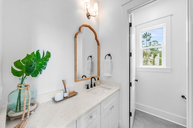 bathroom with tile patterned flooring and vanity