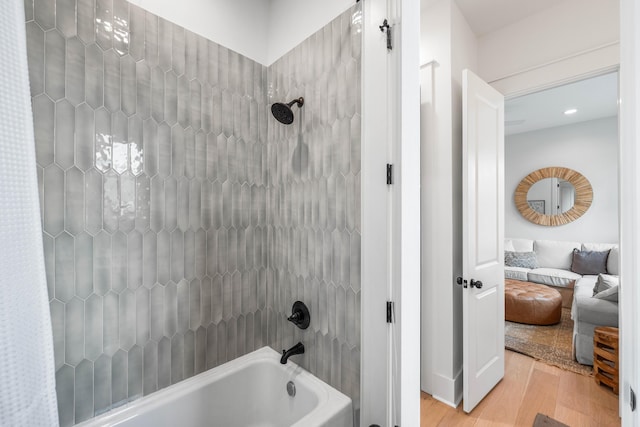 bathroom featuring shower / bath combo and hardwood / wood-style floors