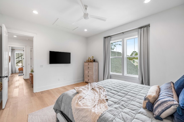 bedroom with ceiling fan and light wood-type flooring