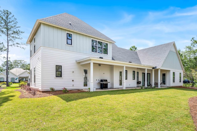 489 Hideaway Cir, Santa Rosa Beach, FL 32459 - rear view of property featuring a shingled roof, board and batten siding, and a lawn