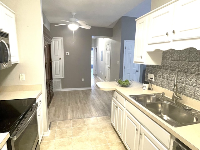 1501 N Partin Dr Unit 209, Niceville, FL 32578 - kitchen featuring backsplash, ceiling fan, electric stove, sink, and light tile patterned floors