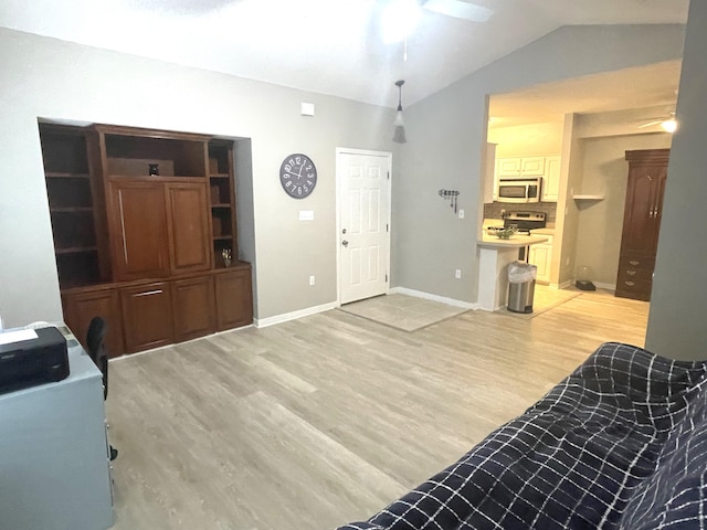 1501 N Partin Dr Unit 209, Niceville, FL 32578 - entrance foyer with ceiling fan, vaulted ceiling, and light wood-type flooring