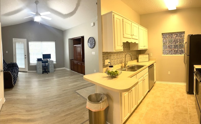 1501 N Partin Dr Unit 209, Niceville, FL 32578 - kitchen featuring lofted ceiling, sink, ceiling fan, appliances with stainless steel finishes, and kitchen peninsula