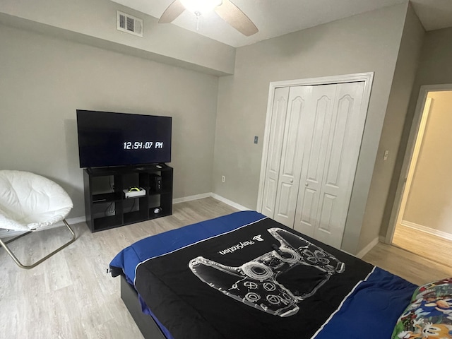 1501 N Partin Dr Unit 209, Niceville, FL 32578 - bedroom featuring wood-type flooring, a closet, and ceiling fan