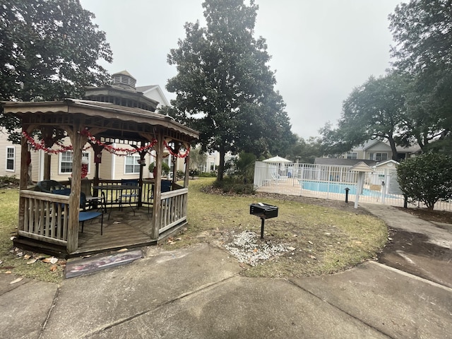 1501 N Partin Dr Unit 209, Niceville, FL 32578 - view of yard with a gazebo and a pool side deck