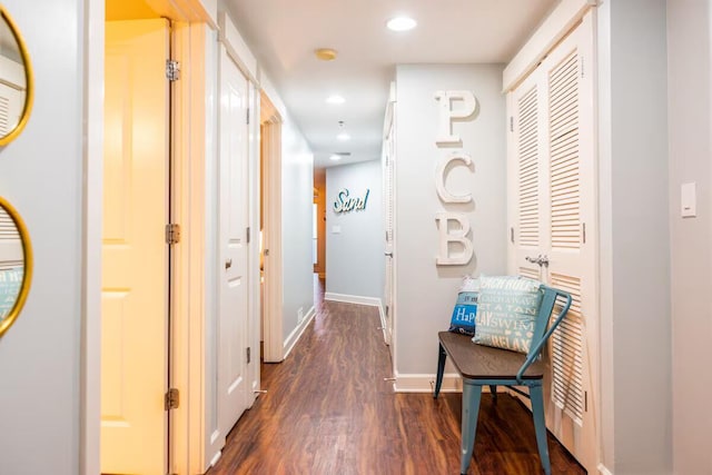 corridor with dark wood-type flooring