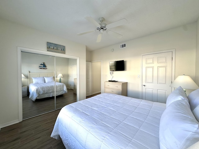 bedroom featuring dark hardwood / wood-style floors and ceiling fan