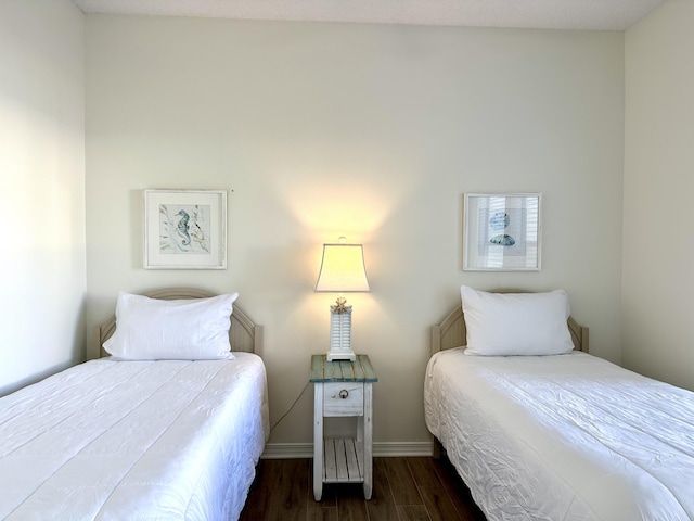 bedroom featuring dark wood-type flooring