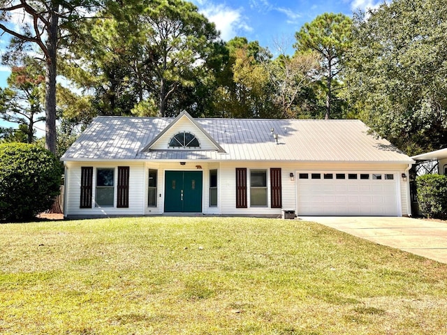 ranch-style home featuring a front lawn and a garage