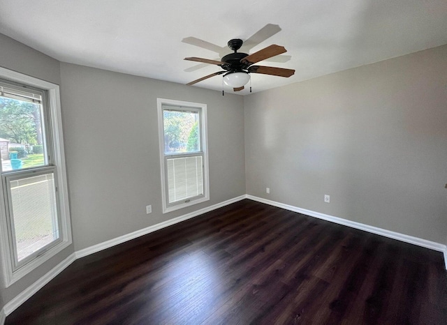 unfurnished room featuring ceiling fan and dark wood-type flooring