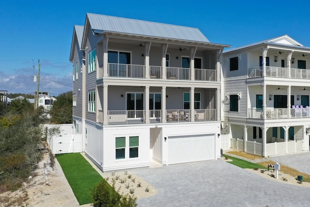 view of front of house with ceiling fan and a garage