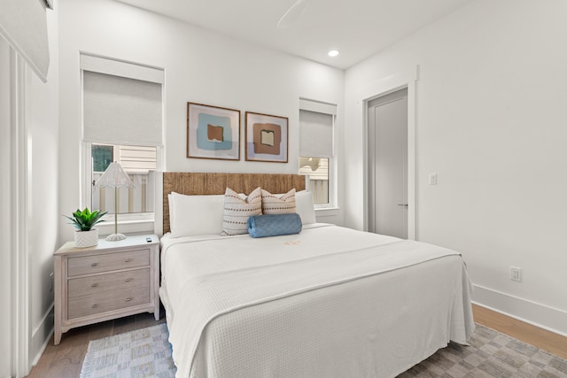 bedroom with wood-type flooring