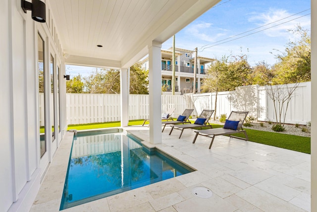 view of swimming pool with a patio