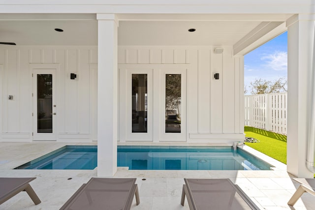 view of swimming pool featuring a patio area