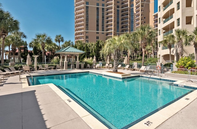 view of swimming pool featuring a patio area